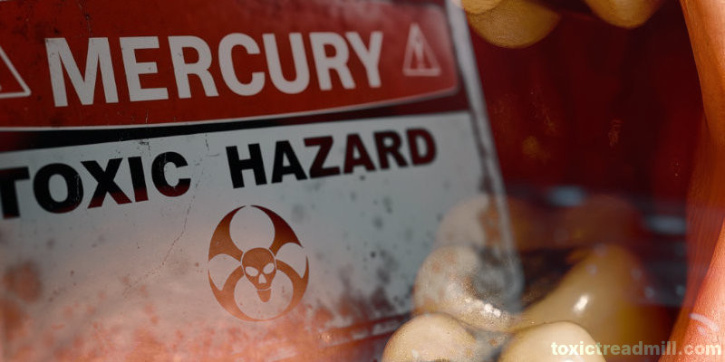 An open mouth with mercury amalgam showing and an overlain toxic mercury sign