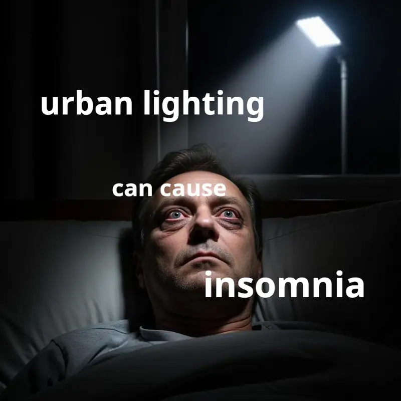 Urban light pollution can cause insomnia A man lying in bed wide awake, a nearby street lamp shines through his window